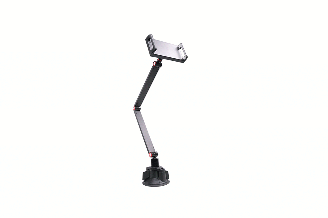 Vacuum suction tablet stand with dual adjustable arms mounted on a smooth desk